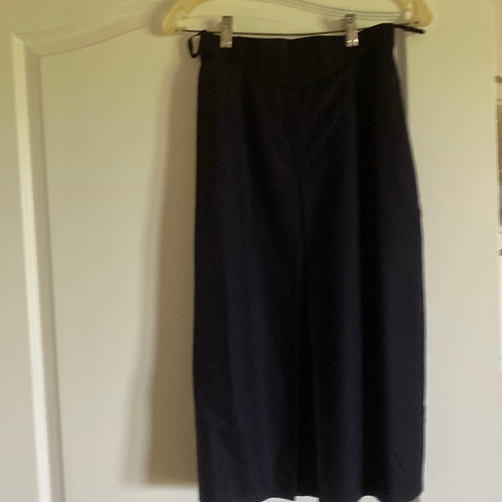 female tuxedo suit with skirt from 1980s. Made of 100% wool material.